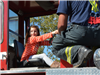 Little Girl Sits in Fire Truck