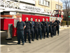 Members of Fire Department Standing Next to Fire Truck